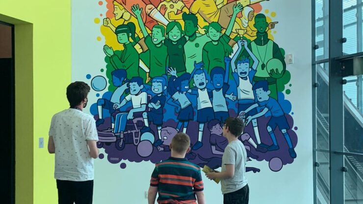 Children viewing the football mural at National Football Museum