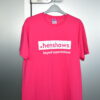 Pink T-shirt with Henshaws logo in write on the front