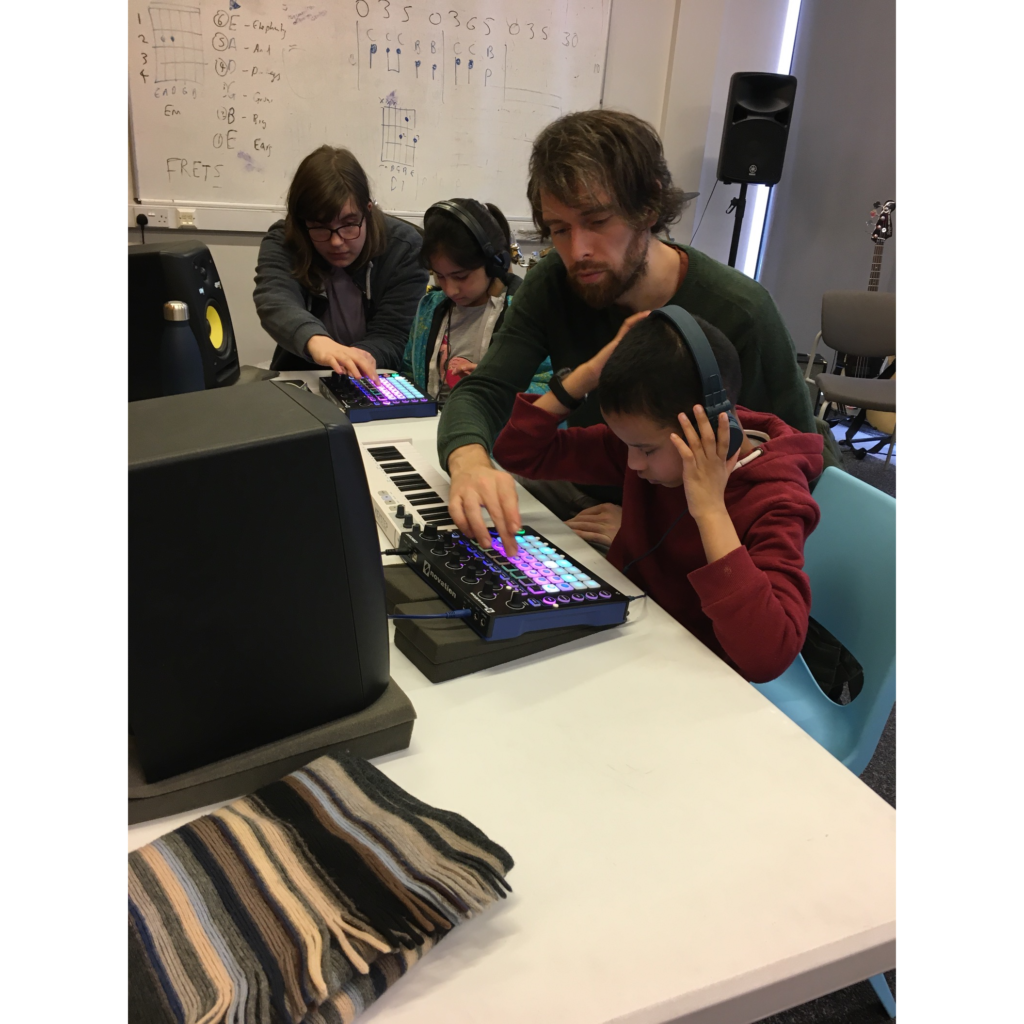 Two groups of two people using the music technology area
