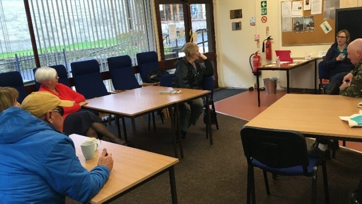Coffee Afternoon group taking part in a quiz with a speaker from Be Well Tameside.