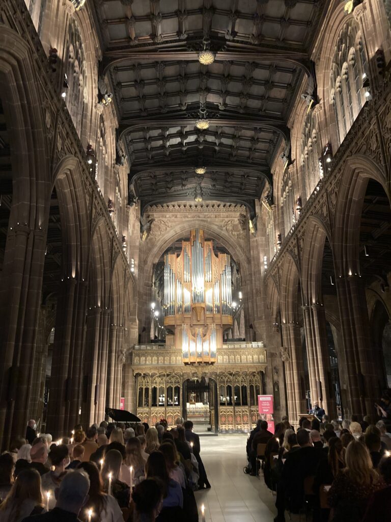 Manchester Cathedral in full view from the back of the venue waiting for Carols by Candlight event to start