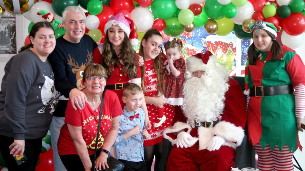 A family photo with Santa at our Manchester party
