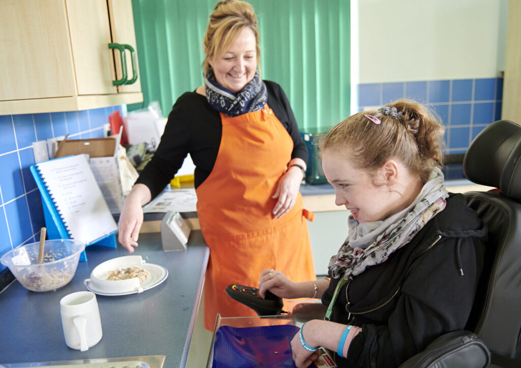 Student Annabel with her support worker in the independence kitchen.