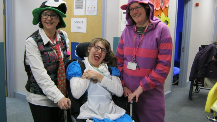 Student Lucy with support workers dressed up for world book day